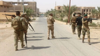 Iraqi forces members patrol during a military operation in Anbar province