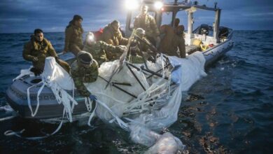 US Navy sailors recover a high-altitude surveillance balloon off the coast