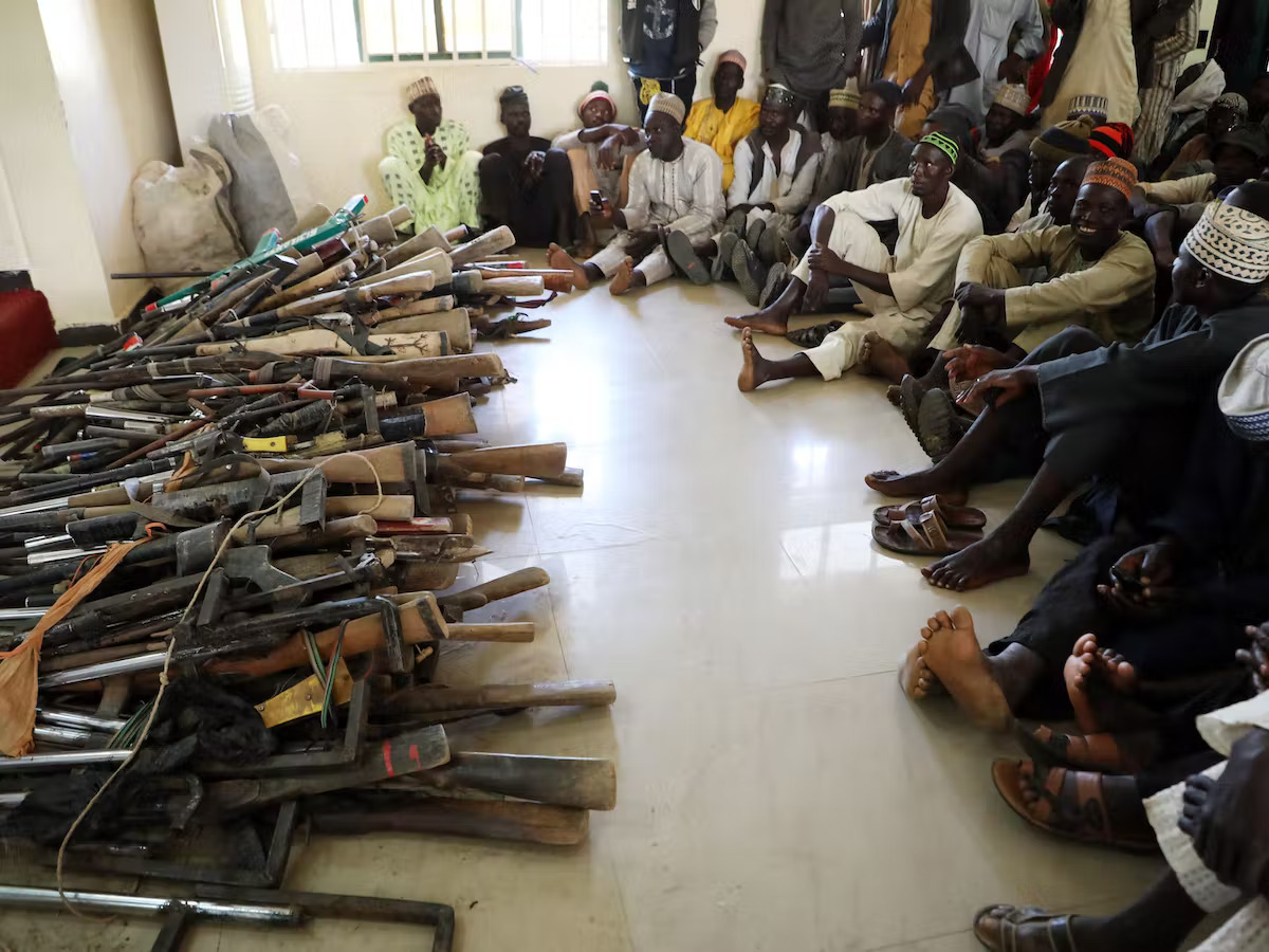A stash of Kalashnikovs and locally made hunting rifles surrendered by a local vigilante group in Zamfara State, northwest Nigeria
