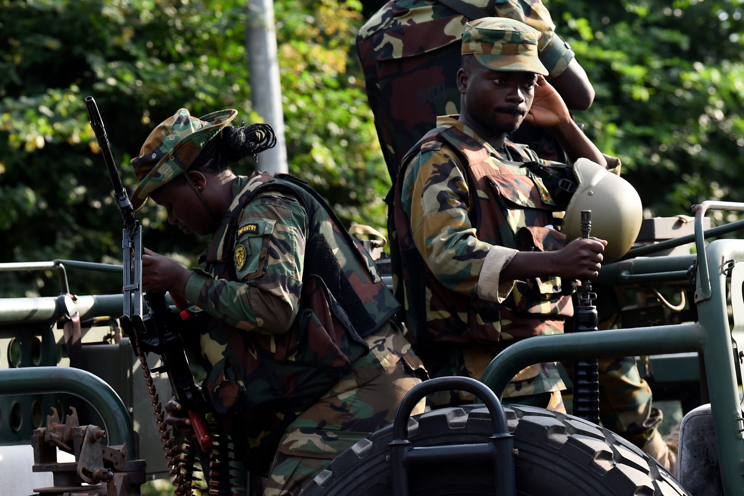Soldiers sit in a truck on the main road of the Electoral Commission, in Accra, Ghana