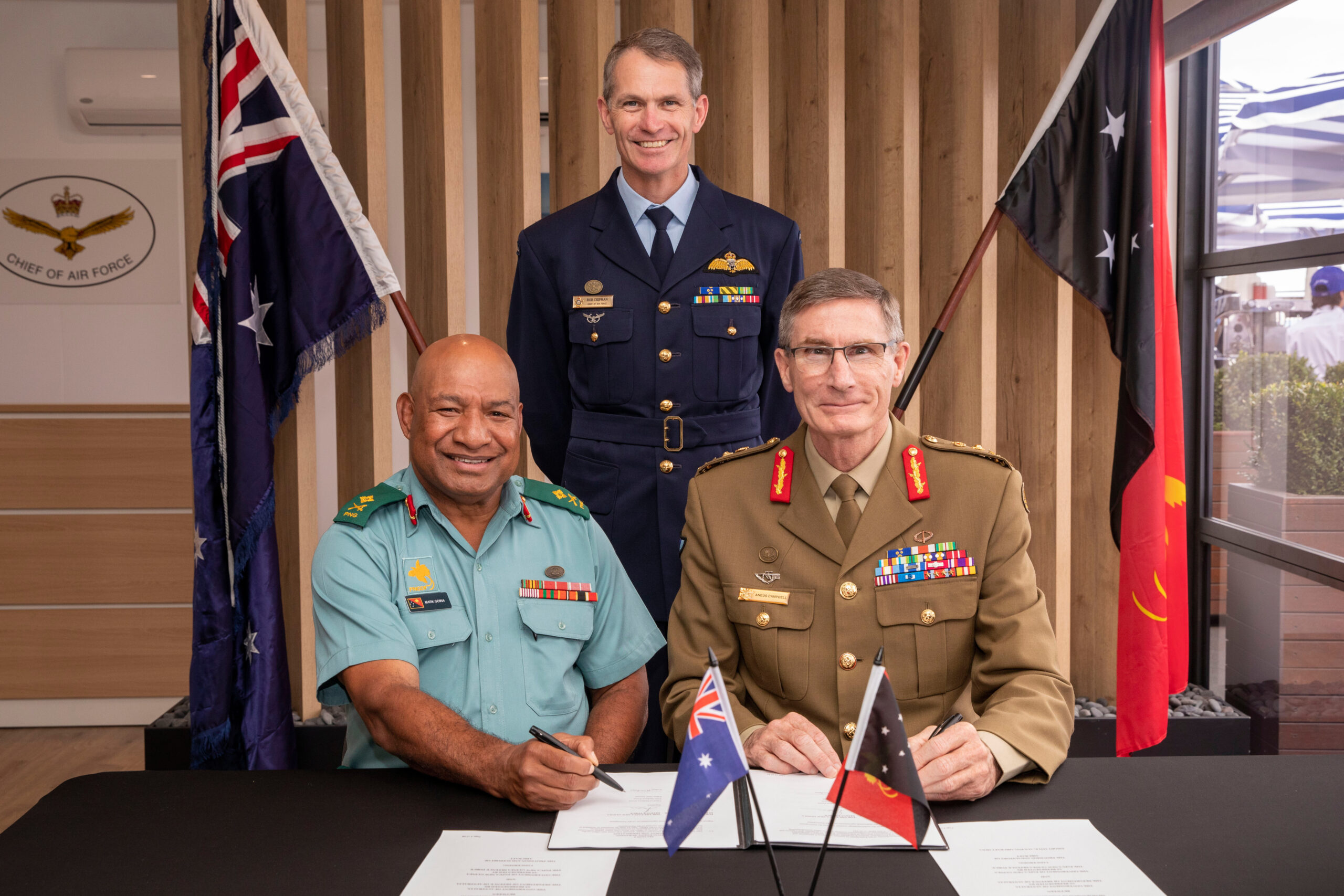 Chief of the Defence Force General Angus Campbell AO, DSC, the Commander of the Papua New Guinea Defence Force, Major General Mark Goina, and Chief of Air Force, Air Marshal Robert Chipman, AM, CSC, following the signing of a Memorandum of Understanding between the two countries.