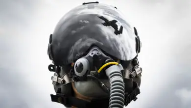 1st Lt. Anton King, 75th Fighter Squadron pilot, poses for a photo wearing an HGU-55/P helmet fitted with Hybrid Optical-based Inertial Tracker and day visor Feb. 11, 2020, at Moody Air Force Base, Georgia. The helmet provides A-10C Thunderbolt II pilots a central interface for everything they need, from oxygen supply to communications to flight instruments. (U.S. Air Force photo illustration by Airman 1st Class Hayden Legg) (This image was manipulated by merging two photos in Adobe Photoshop.)