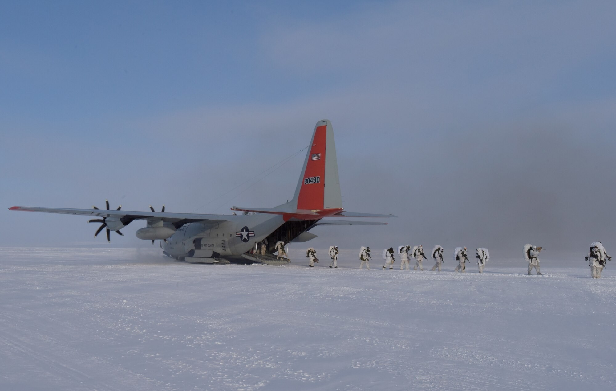 US and Canadian soldiers practice and conduct tactical insertion on an open ice skiway delivered by an LC-130 Hercules