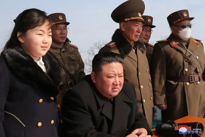 North Korea's leader Kim Jong Un and his daughter observing a warhead missile launch exercise simulating a tactical nuclear attack