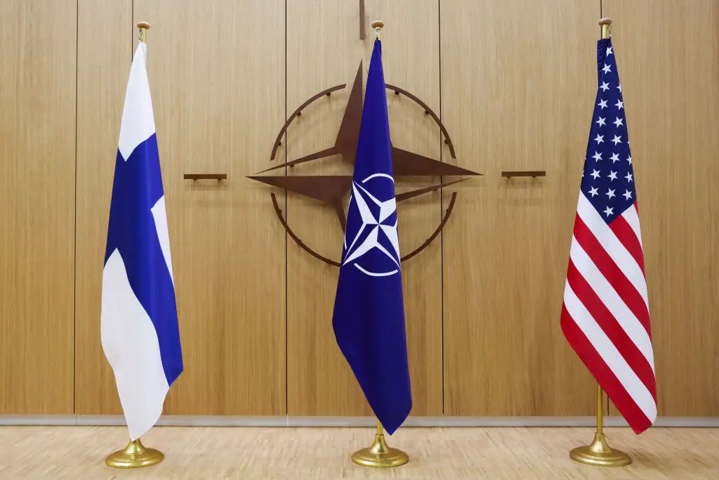 Finnish, NATO, and US flags