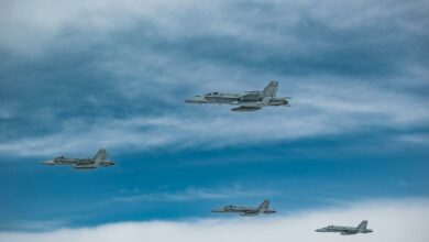 Four Finnish F/A-18 fighters fly in formation.