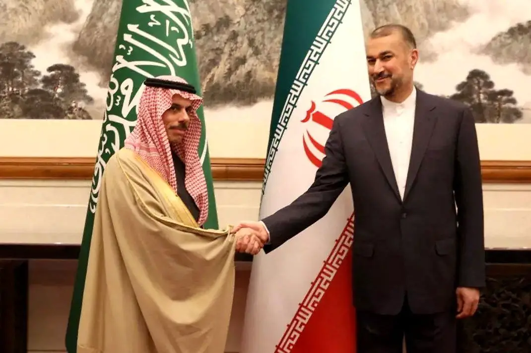 Iran's Foreign Minister Hossein Amirabdollahian (R) and Saudi Foreign Affairs Minister Prince Faisal bin Farhan Al-Saud (L) meeting in Beijing, China, April 6