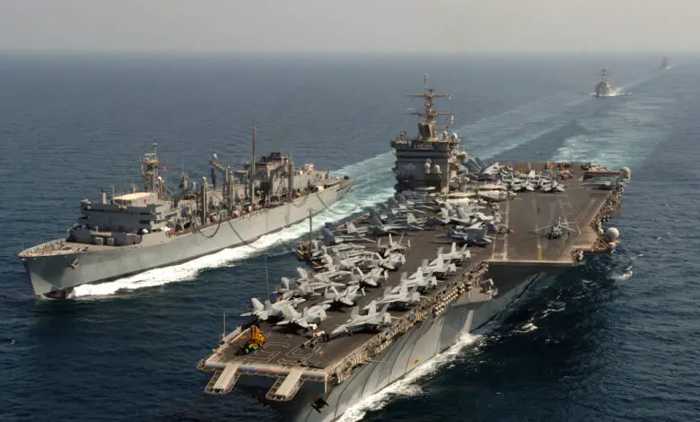 The nuclear-powered aircraft carrier USS Enterprise (CVN-65), conducts an underway replenishment with the Military Sealift Command fast combat support ship USNS Supply (T-AOE 6).