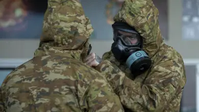 Australian Army soldiers from the 8th/9th Battalion, The Royal Australian Battalion conduct buddy checks during a Chemical, Biological, Radiological, Nuclear Defence (CBRN-D) training serial at Gallipoli Barracks, Queensland. *** Local Caption *** Soldiers from 8th/9th Battalion, The Royal Australian Regiment, conducted chemical, biological, radiological and nuclear defence (CBRN-D) training in April at Gallipoli Barracks, Brisbane. Members were educated about what to do in a location with a CBRN-D threat, and how to rapidly apply personal protective equipment. They were also trained on how to treat a casualty in that environment and evacuate them from the area.