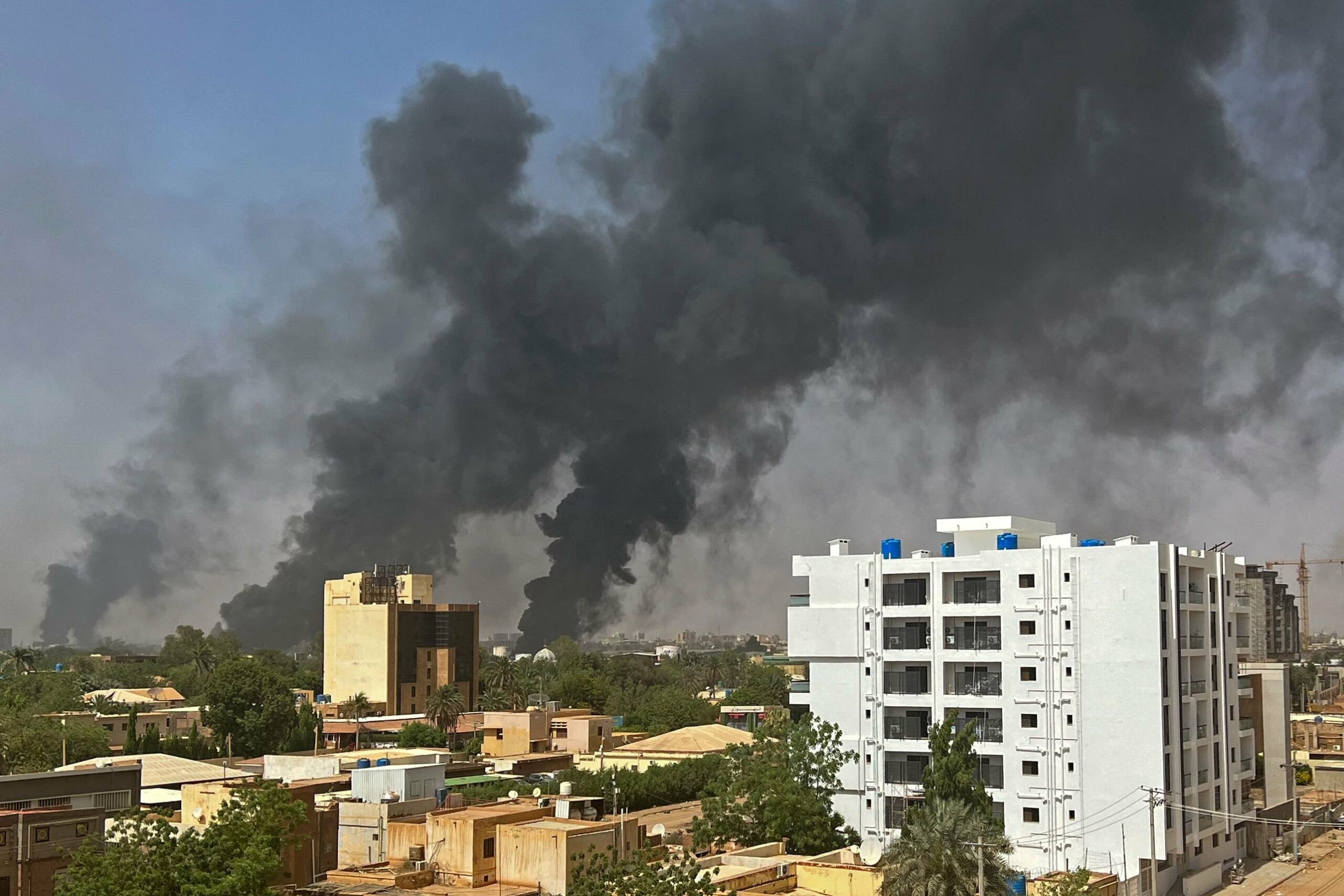 Smoke billows above residential buildings as fighting raged between rival generals in Khartoum, Sudan