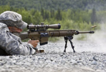 Spc. Wesley Cullman, Headquarters and Headquarters Company, 3rd Battalion (Airborne), 509th Infantry Regiment, engages targets during M110 Semi-Automatic Sniper System qualifications at Grezelka Range, June 25, 2013. (U.S. Air Force photo/Percy G. Jones)