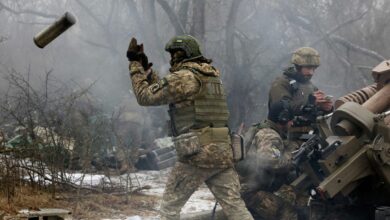 Ukrainian soldiers fire at Russian position