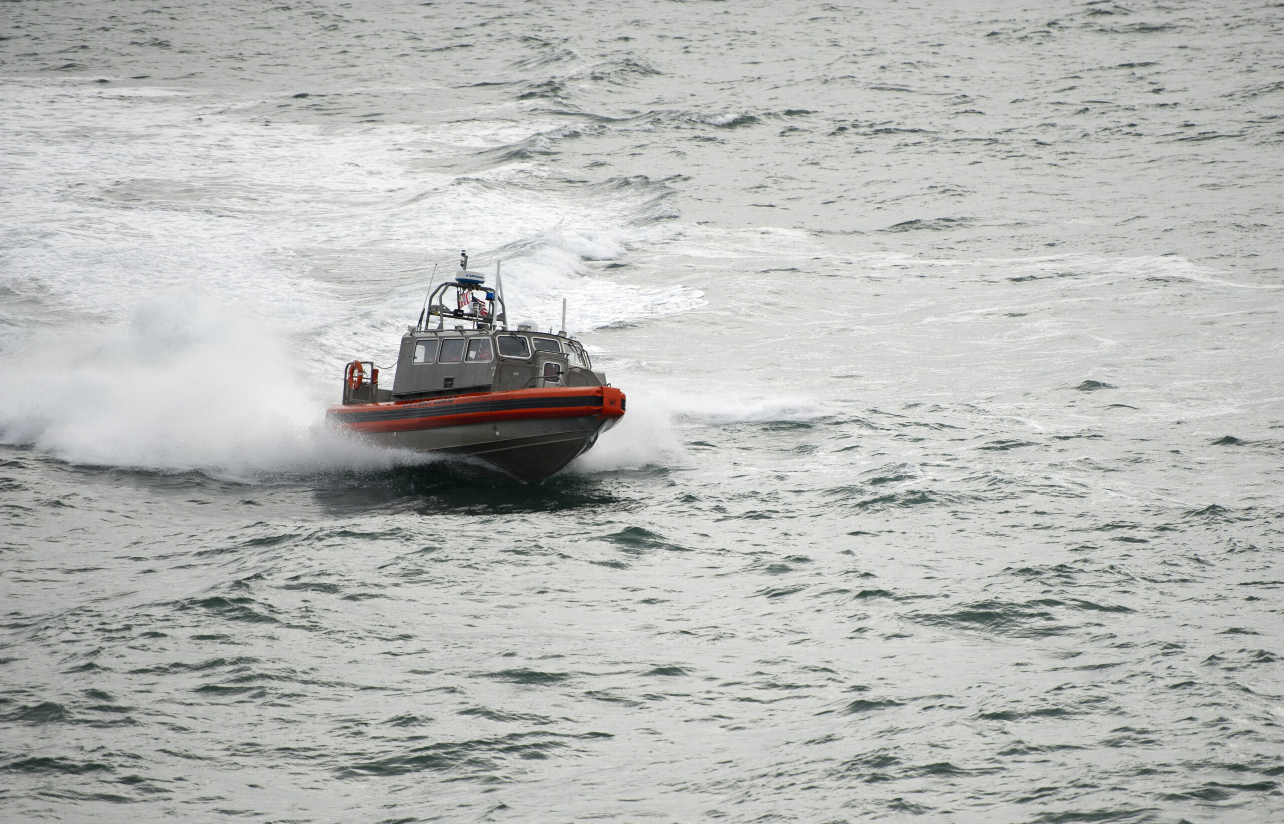 A Coast Guard small boat crew from the Coast Guard Cutter Bertholf operates a Long Range Interceptor in the Arctic Ocean, Sept. 1, 2012. The LRI has an enclosed cabin that protects the crew and enables them to stay out of the weather elements in order to stay on scene longer. The Bertholf crew is deployed in support of Operation Arctic Shield, during which the Coast Guard will test its Arctic capabilities while building partnerships with local communities to perform its maritime safety, maritime security and stewardship missions. (U.S. Coast Guard photo by Petty Officer 1st Class Timothy Tamargo)