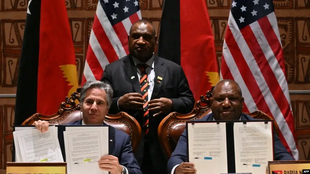 US Secretary of State Antony Blinken (L), Papua New Guinea Defense Minister Win Bakri Daki and Prime Minister James Marape at the security pact signing in May