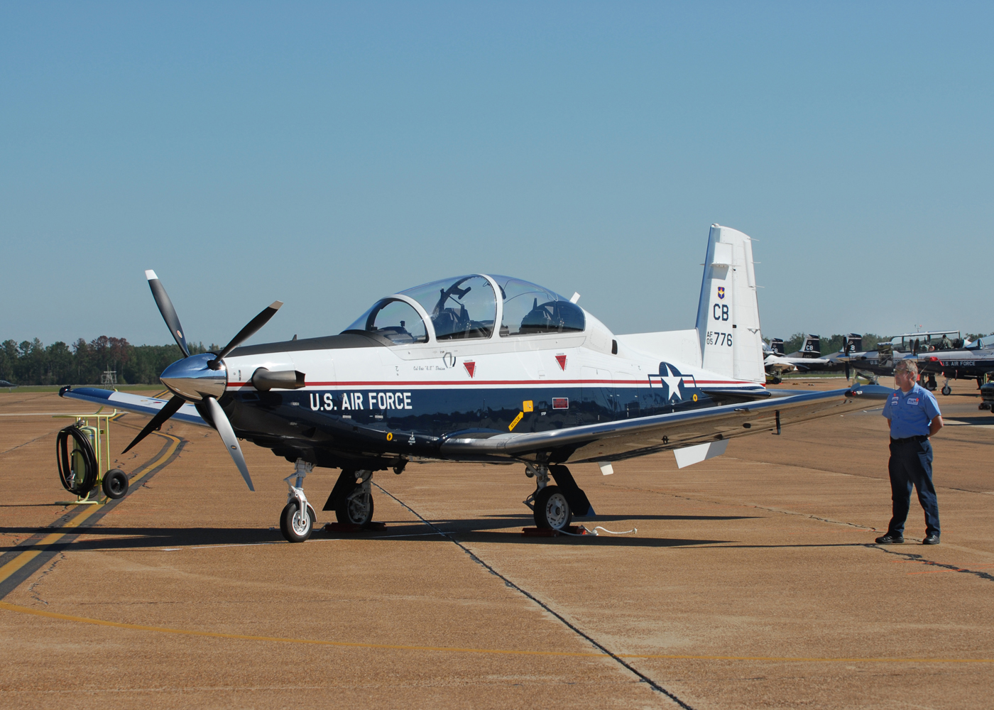 The T-6A Texan II is a single-engine, two-seat primary trainer designed to train Joint Primary Pilot Training students in basic flying skills common to US Air Force and Navy pilots