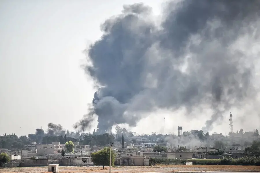 Smoke billows from a fire inside Syria during bombardment by Turkish forces