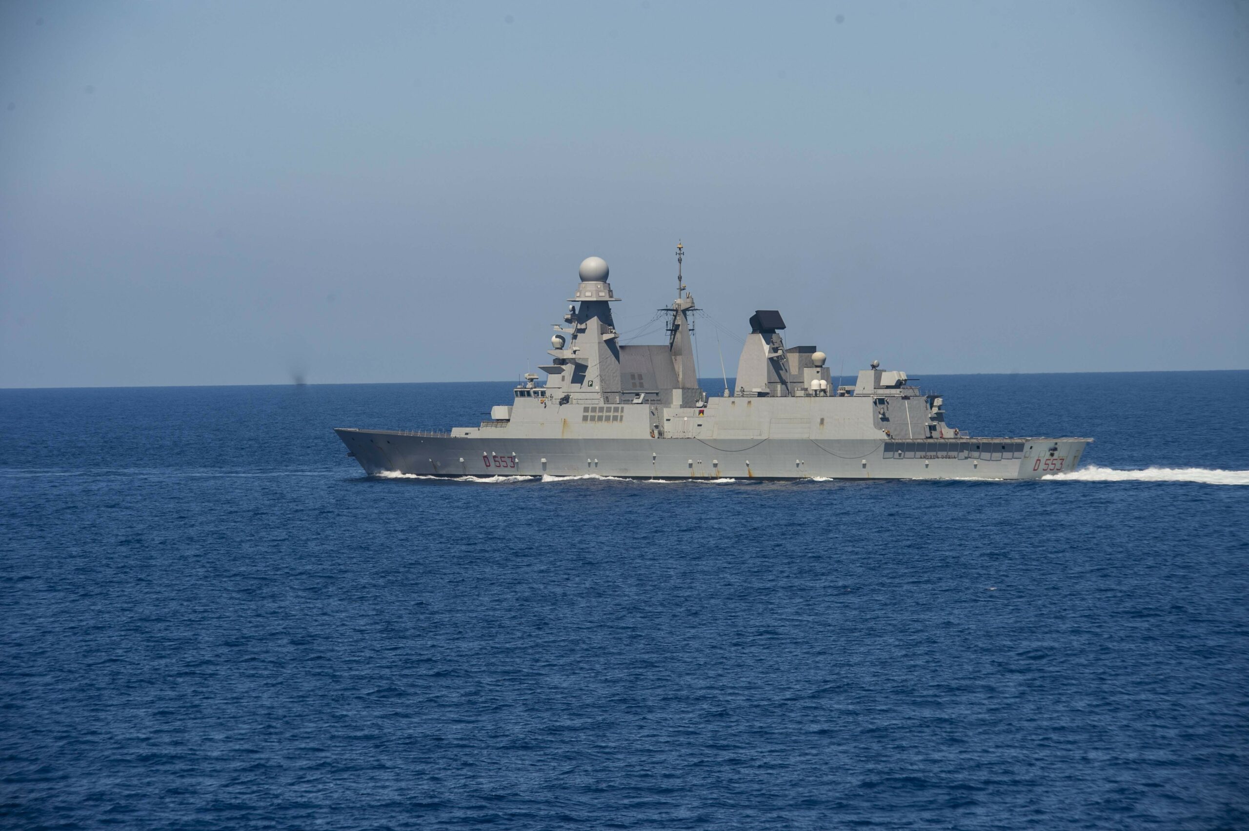 210703-N-RG587-1036 MEDITERRANEAN SEA (July 3, 2021) Italian Navy destroyer ITS Andrea Doria(D 553), sails alongside guided-missile cruiser USS Vella Gulf (CG 72), during operations in the Mediterranean Sea, July 3. Vella Gulf is operating with the Eisenhower Carrier Strike Group on a routine deployment in the U.S. Sixth Fleet area of operations in support of U.S. national interests and security in Europe and Africa. (U.S. Navy photo by Mass Communication Specialist 2nd Class Dean M. Cates)