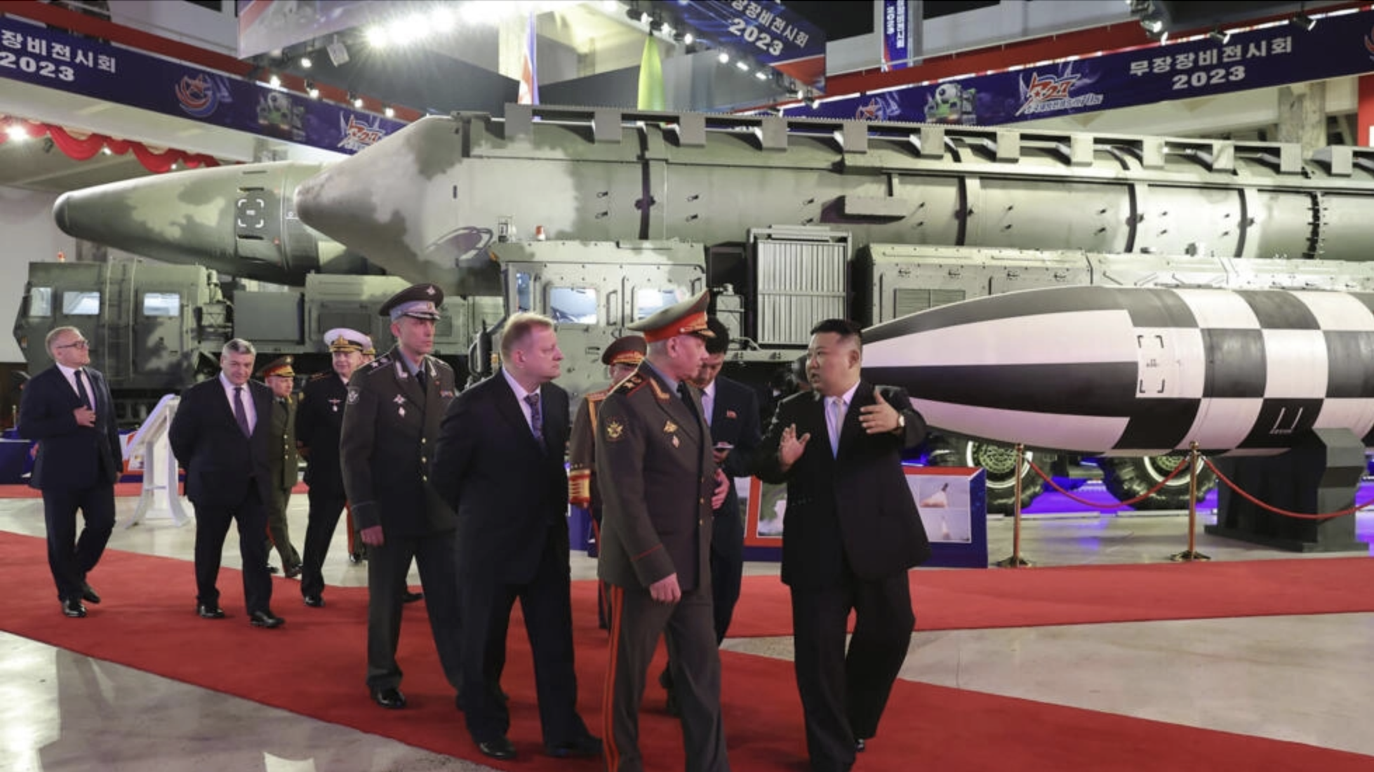 Leader Kim Jong Un (R) visits an exhibition of North Korean weaponry with visiting Russian Defense Minister Sergei Shoigu