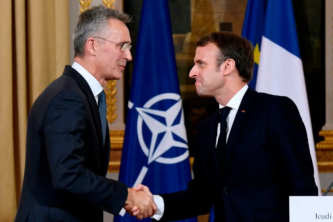 French President Emmanuel Macron and NATO Secretary-General Jens Stoltenberg shake hands