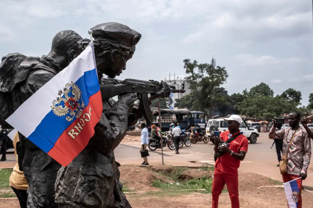 A Russian flag emblazoned with the emblem of Russia hangs on a monument to Russia’s so-called military instructors in Bangui, Central African Republic
