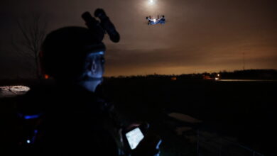 Personnel operating a Teal 2 drone at night