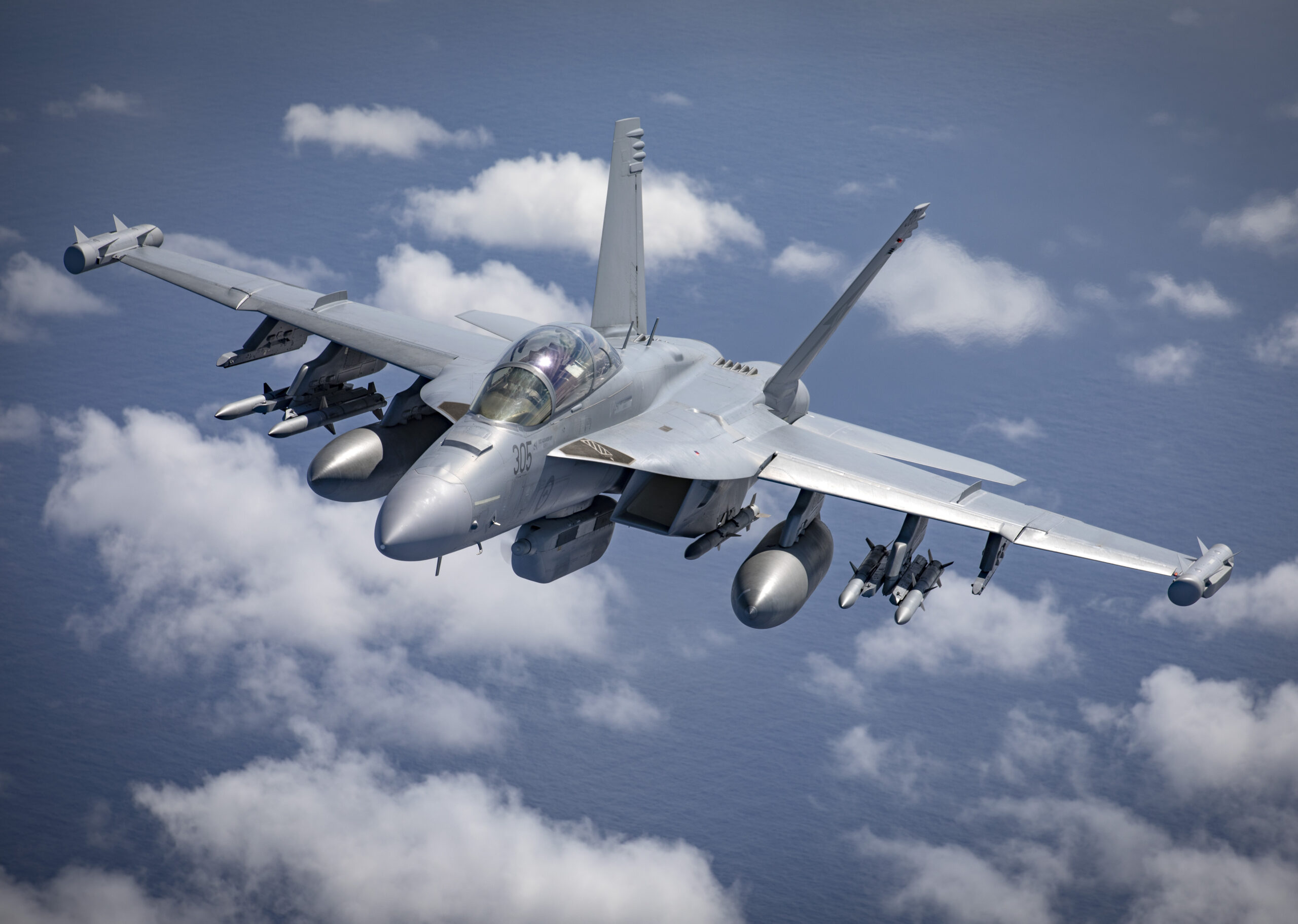 A46-305 EA-18G Growler from No. 6 Squadron conducts air-to-air formation flying off the coast of South East Queensland. *** Local Caption *** On 07 December 2021, No. 6, No. 1 and No. 36 Squadrons from RAAF Base Amberley conducted a formation flying activity with EA-18G Growlers, F/A-18F Super Hornets and a C-17A Globemaster III Aircraft off the coast of South East Queensland.