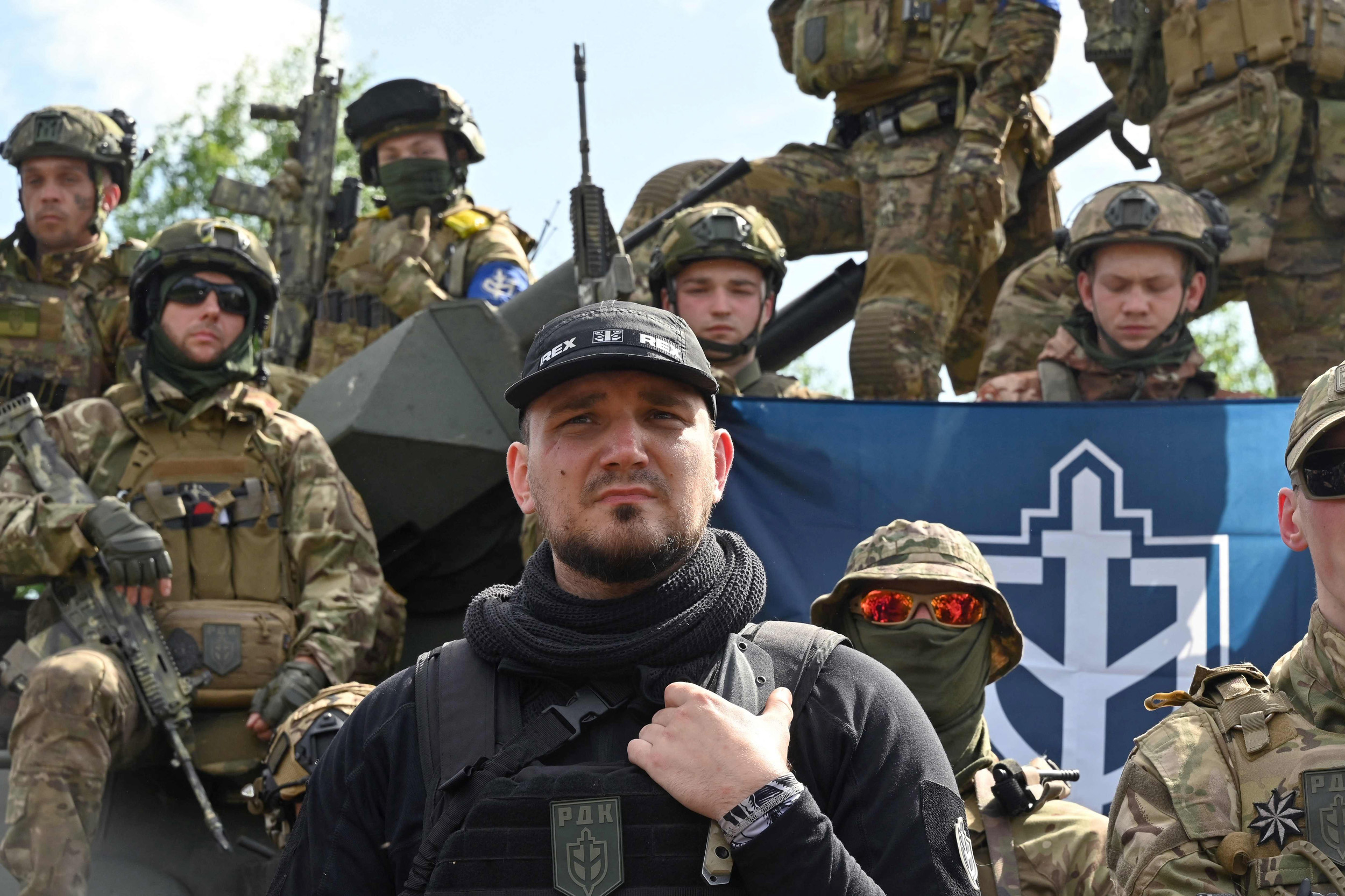The founder of the Russian Volunteer Corps, Denis Kapustin, flanked by fighters in northern Ukraine, not far from the Russian border