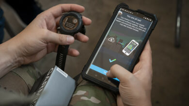 A Guardian syncs data from a wearable device to a phone during a Continuous Fitness Assessment, or CFA, study informational session hosted by an Air Force Research Laboratory team at a facility near Wright-Patterson Air Force Base, Ohio, June 8, 2023. The CFA study is a two-year voluntary effort with Guardians to assess the use of wearable fitness devices that measure physical activity. The CFA is part of the U.S. Space Force’s Holistic Health Approach, an initiative that promotes wellness through positive behaviors and seeks to replace traditional military fitness tests with data from continuous monitoring technology. (U.S. Space Force photo / Rick Eldridge).