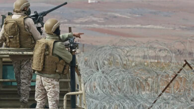 Jordanian soldiers patrol along the border with Syria