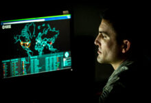 Cyber warfare operations journeyman assigned to the 175th Cyberspace Operations Group of the Maryland Air National Guard monitors live cyber attacks