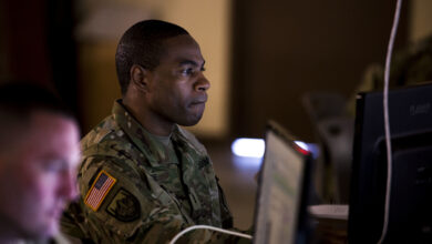 US Army Chief Warrant Officer studies course content during the training week of Cyber Shield 18 at Camp Atterbury Indiana, 2018