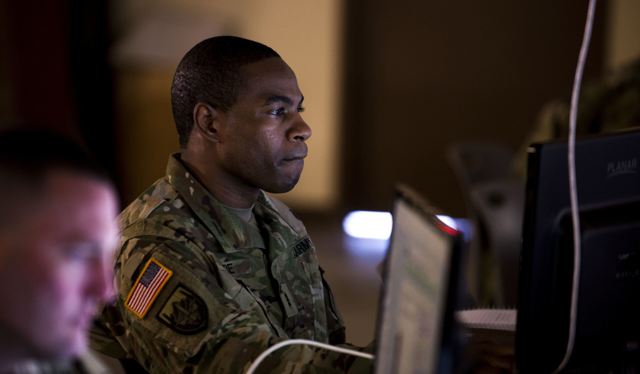 US Army Chief Warrant Officer studies course content during the training week of Cyber Shield 18 at Camp Atterbury Indiana, 2018
