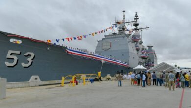 The Ticonderoga-class guided-missile cruiser USS Mobile Bay (CG 53) sits pier side during a decommissioning ceremony. The Mobile Bay was decommissioned after more than 36 years of distinguished service