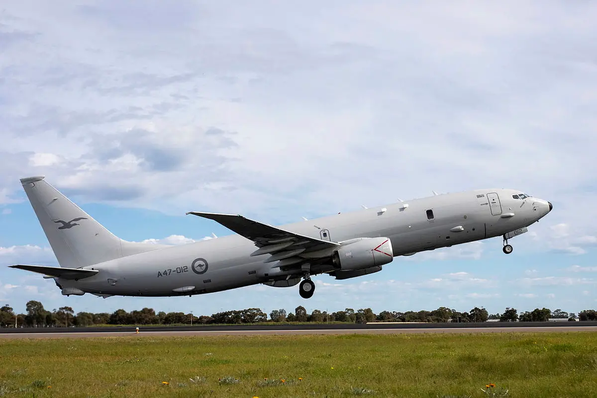 A Royal Australian Air Force P-8A Poseidon aircraft departs to Japan as part of Operation ARGOS. It hovers a few meters above ground just as it begins to take off.
