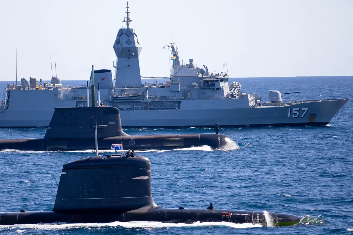 INS Vagir, HMAS Rankin, and HMAS Perth conduct manoeuvre exercise at the Western Australian Exercise Area during the Indian Submarine INS Vagir visit to Fleet Base West in Perth, Western Australia