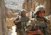 Azerbaijani soldiers patrol to respond to possible new attacks