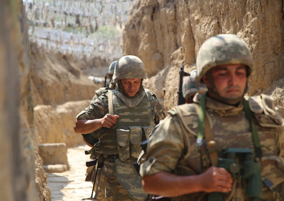 Azerbaijani soldiers patrol to respond to possible new attacks