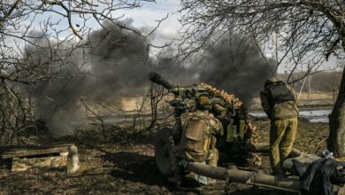 Ukrainian servicemen fire a 105mm Howitzer towards Russian positions near the city of Bakhmut