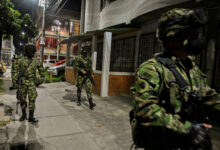 Soldiers patrol a street in Cali, Colombia