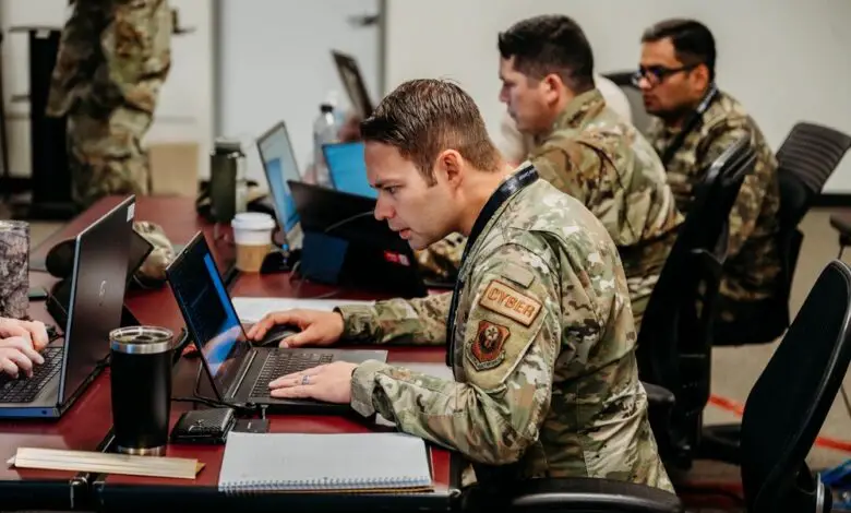 Members of the Oklahoma National Guard cybersecurity team work together to defend networks during Cyber Shield 2023
