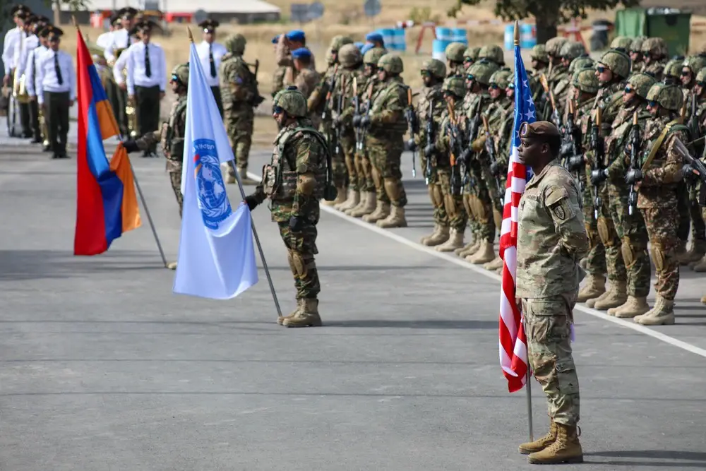 Soldiers from the Kansas National Guard and 1st Brigade Combat Team, 101st Airborne Division hold an opening day ceremony for Eagle Partner 2023 in a training area in Armenia