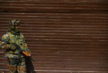 An Indian soldier stands guard in Srinagar, 2022