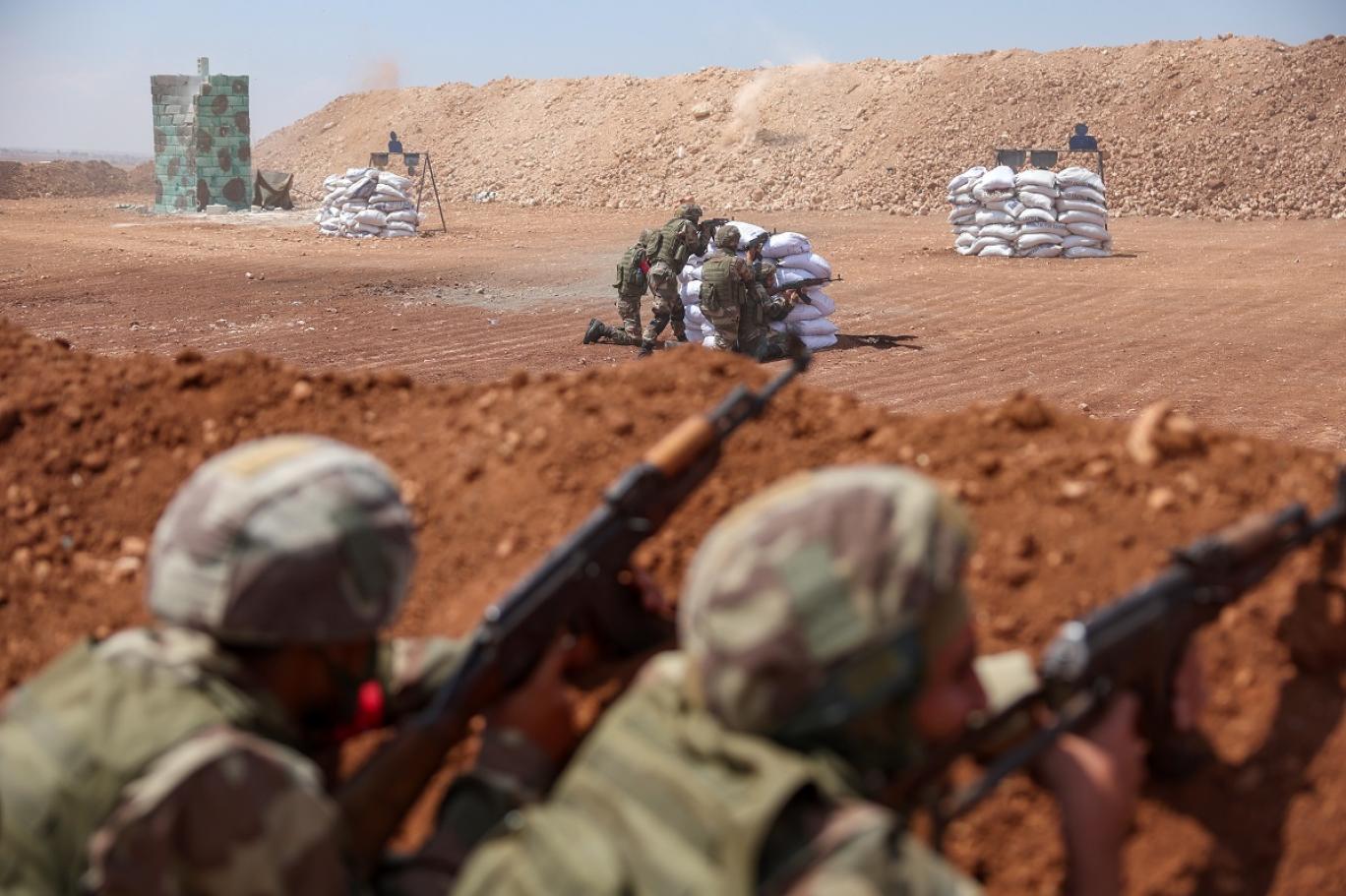 Turkey-backed Syrian fighters take part in a military training near the town of Marea, in the rebel-controlled northern part of Syria’s Aleppo province