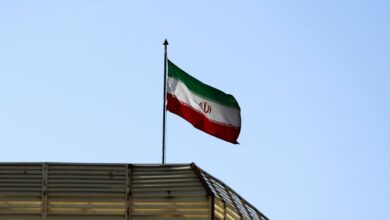 Iranian flag flying over a building