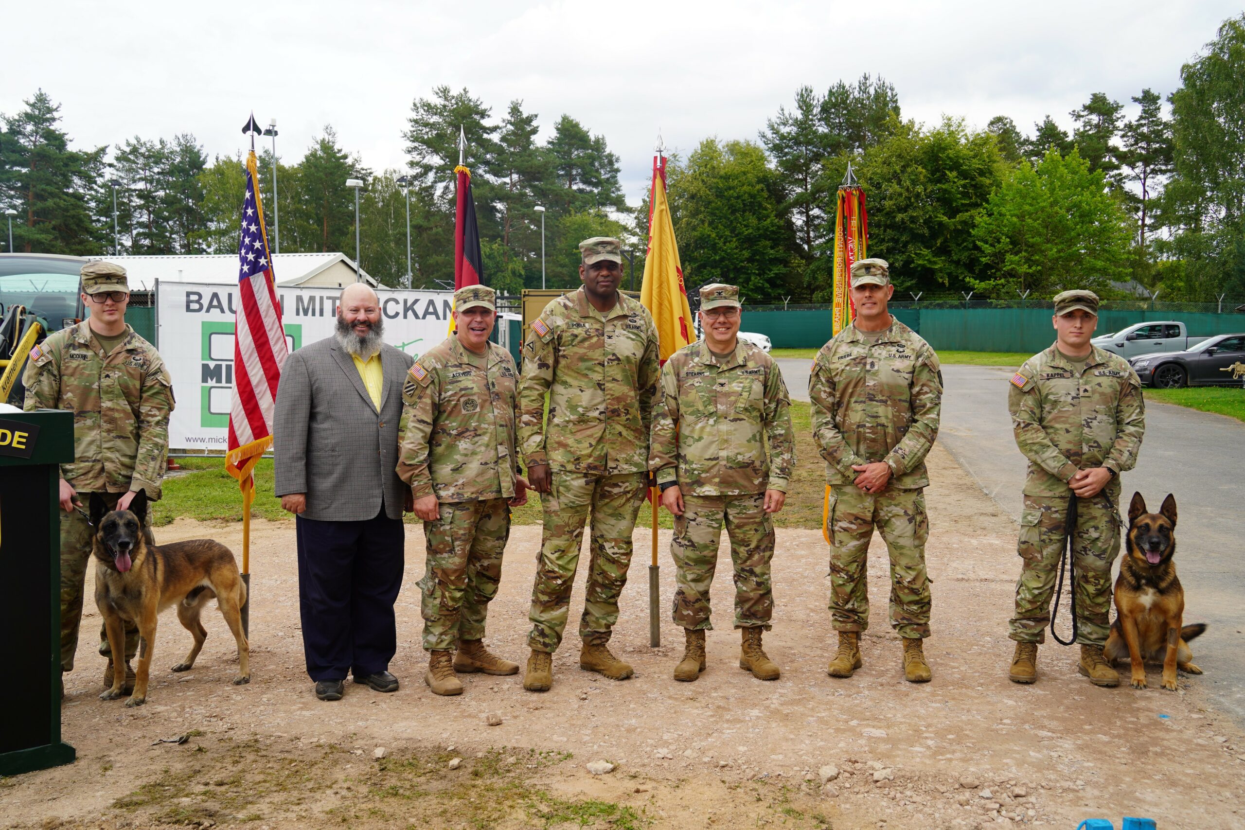 US Army Garrison Bavaria personnel with military working dogs Andy, 8, and Blus, 6.