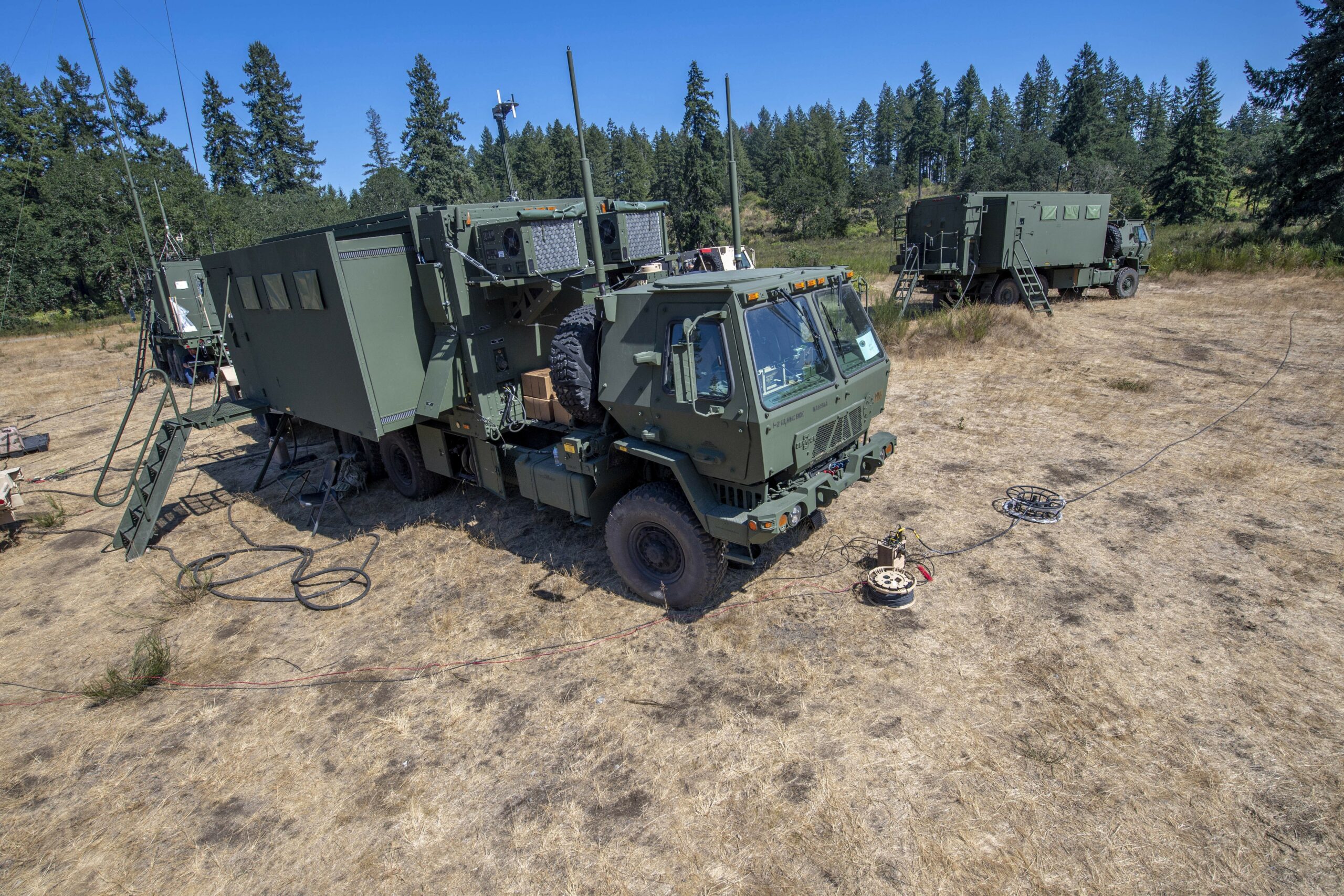 A representative vehicle of the Inc. 0 of the Command Post Integrated Infrastructure (CPI2) is in position at a field location at Joint base Lewis-McChord as communication Soldiers of the 1st Stryker Brigade Combat Team “Ghost,” 2nd Infantry Division participate in operational testing of the system. Data points collected during the test will be used to assess operational effectiveness, suitability, and survivability of CPI2. (U.S. Army photo by Tad Browning)