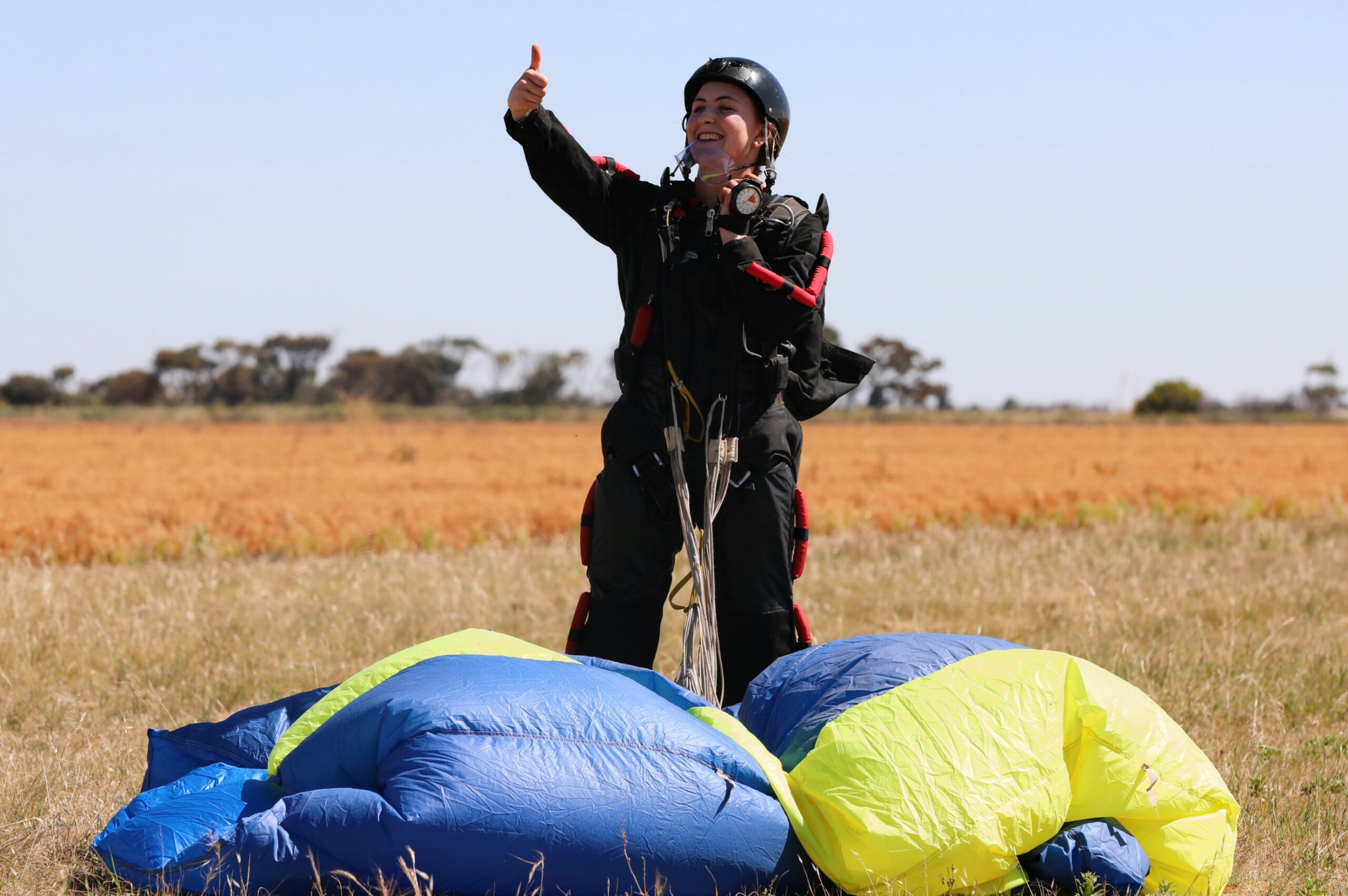 Lieutenant Grace Neuhaus gives the thumbs up following a successful landing during the accelerated freefall course at the Adelaide Skydiving Centre, South Australia. *** Local Caption *** Australian Army soldiers from 1st Armoured Regiment participated in resilience training at Lower Light, South Australia in October 2023. The activity focused on skydiving with members training with Adelaide Skydiving Centre to go from novices through to obtaining their A licence at the conclusion of the course.