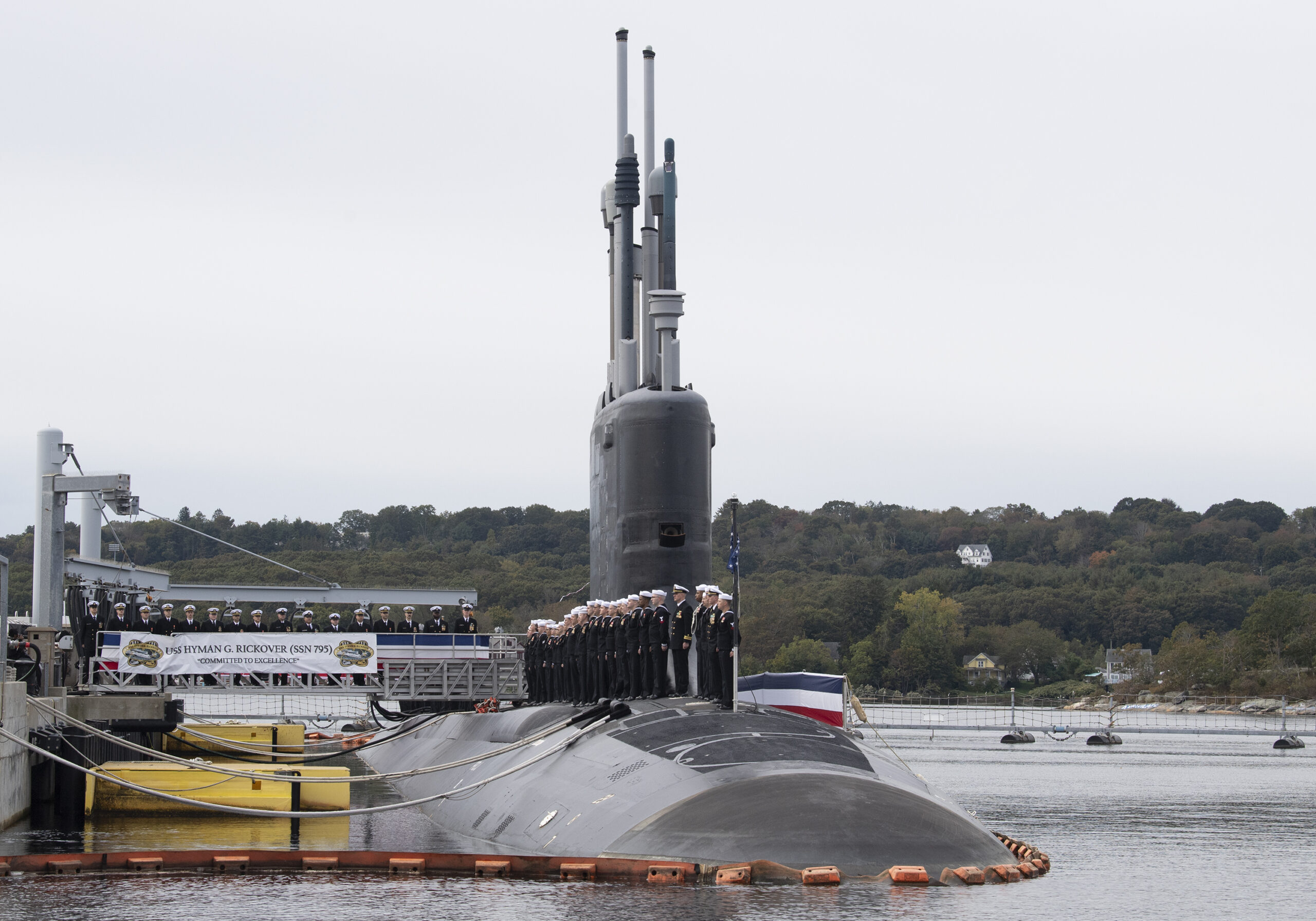 231014-N-GR655-1541 GROTON, Conn. (October 14, 2023) – Crewmembers of USS Hyman G. Rickover (SSN 795) perform a ceremonial manning of the ship during a commissioning ceremony at Naval Submarine Base New London in Groton, Connecticut on October 14, 2023. SSN 795, the second U.S. Navy submarine to commemorate the “father of the nuclear Navy” Adm. Hyman G. Rickover, operates under Submarine Squadron (SUBRON) FOUR. Whose primary mission is to provide attack submarines that are ready, willing, and able to meet the unique challenges of undersea combat and deployed operations in un unforgiving environments across the globe. (U.S. Navy photo by John Narewski)