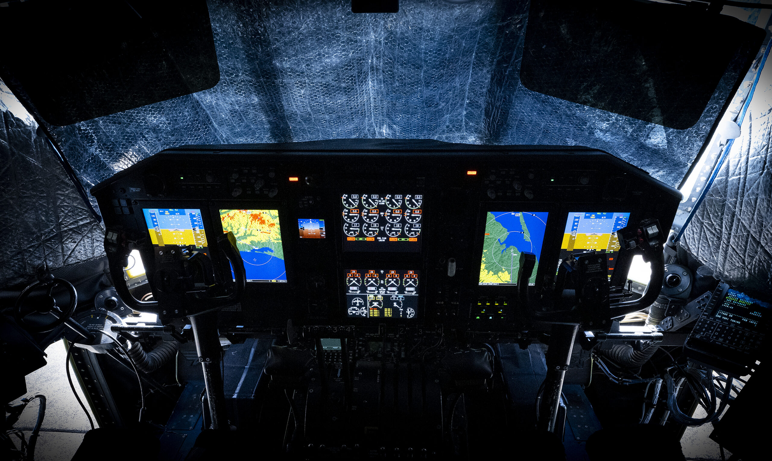 The newly all digital C-130H cockpit sits ready for its next test flight at Eglin Air Force Base, Fla. The major upgrade, called Avionics Modernization Program Increment 2, is a significant improvement to the almost 60-year-old aircraft’s avionics and navigation systems. (U.S. Air Force photo/Samuel King Jr.)