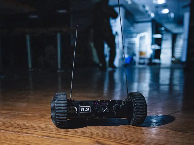 A throwbot is remotely controlled by troops to go into buildings and give a live feed of the environment before troops enter the building to minimise casualty